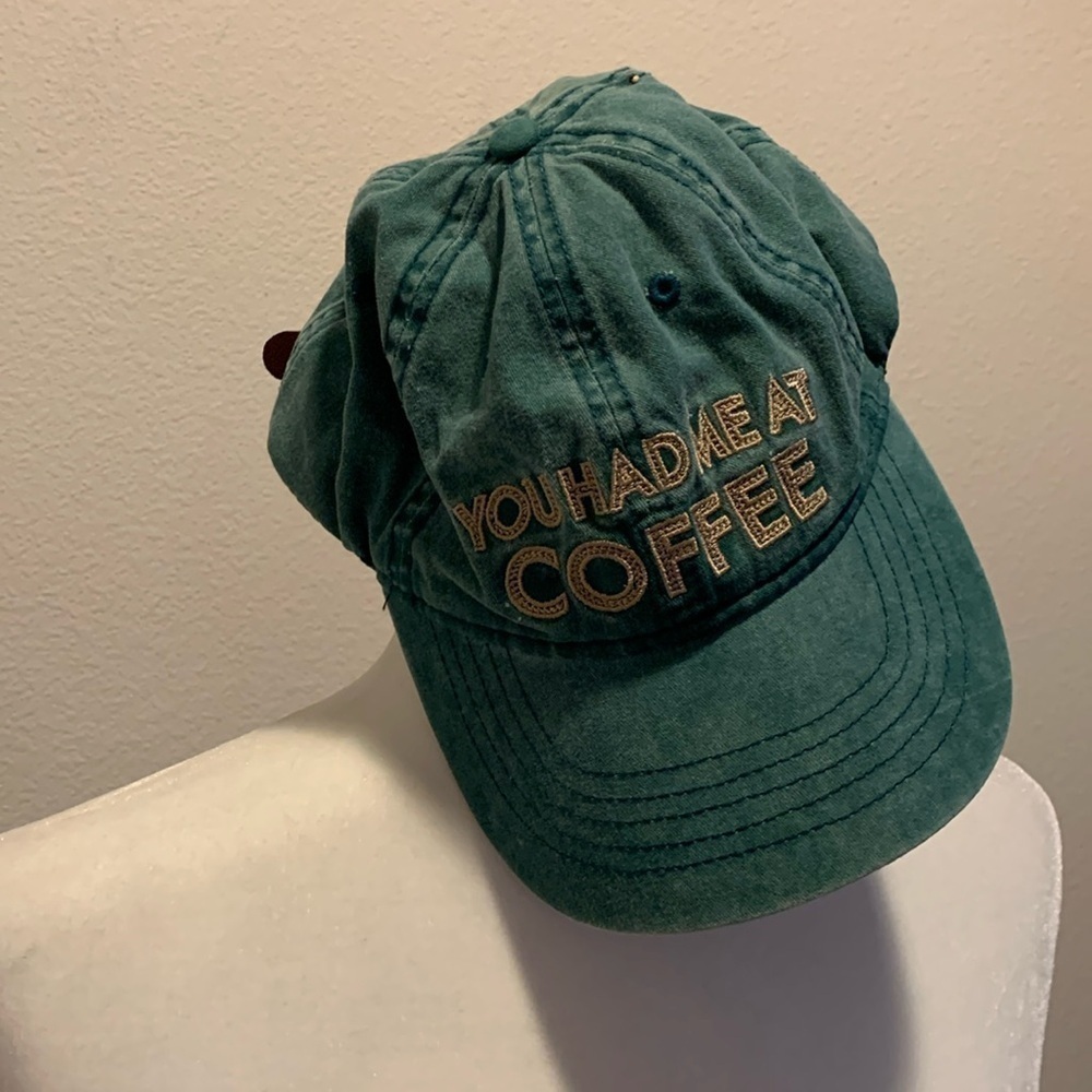 Hat Graphic: “You had me at coffee”. Green. Measures 7.5” across. Adj. Strap.‍﻿﻿